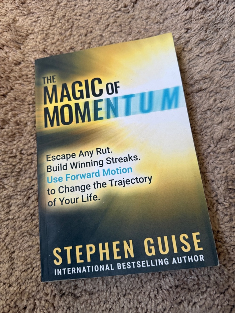 The Magic of Momentum by Stephen Guise - Yellow & Blue Cover